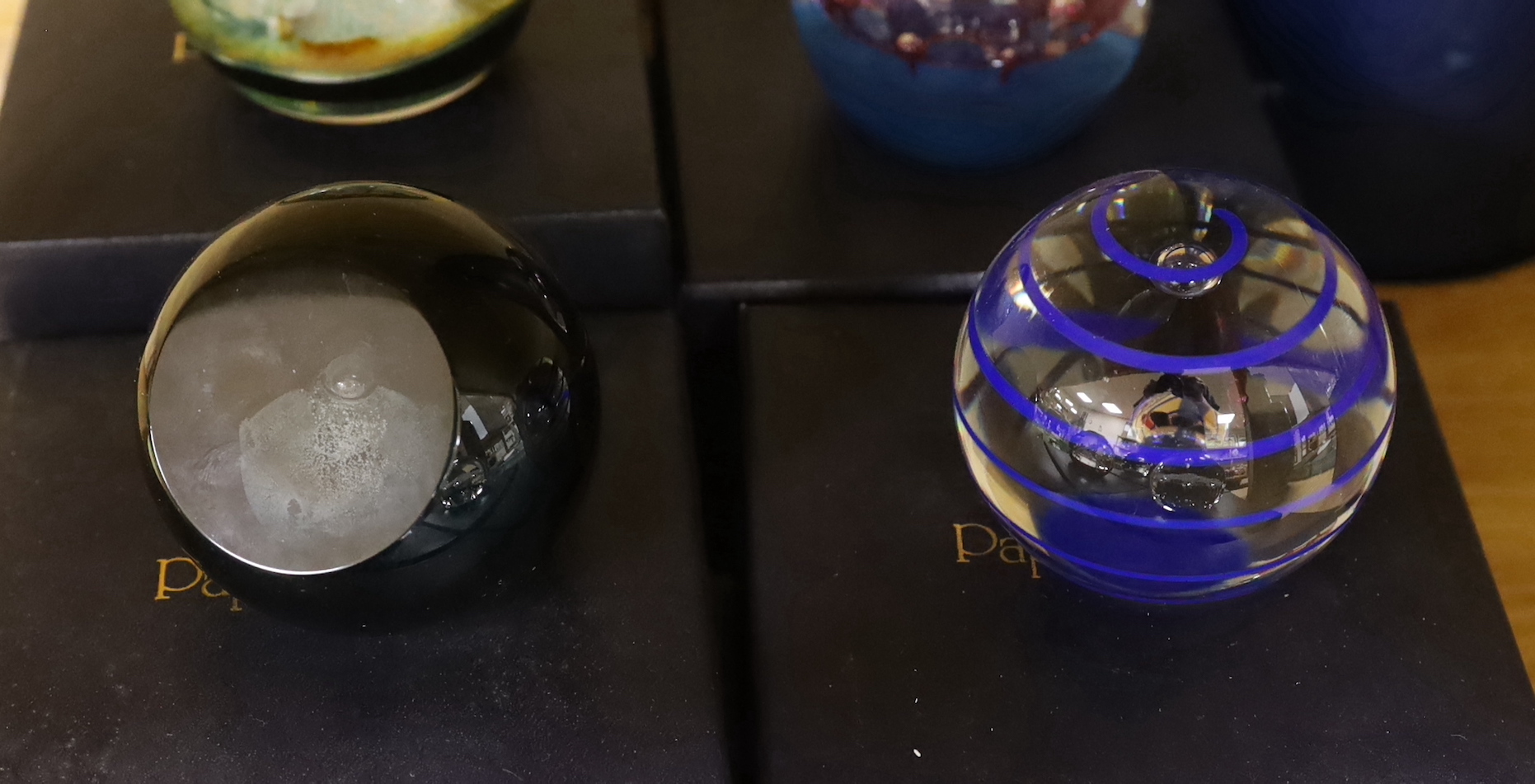 Ten Caithness paperweights including Viking Flame, limited edition 216/750 and Eterna, 175/500, each with boxes, the largest 7.5cm high